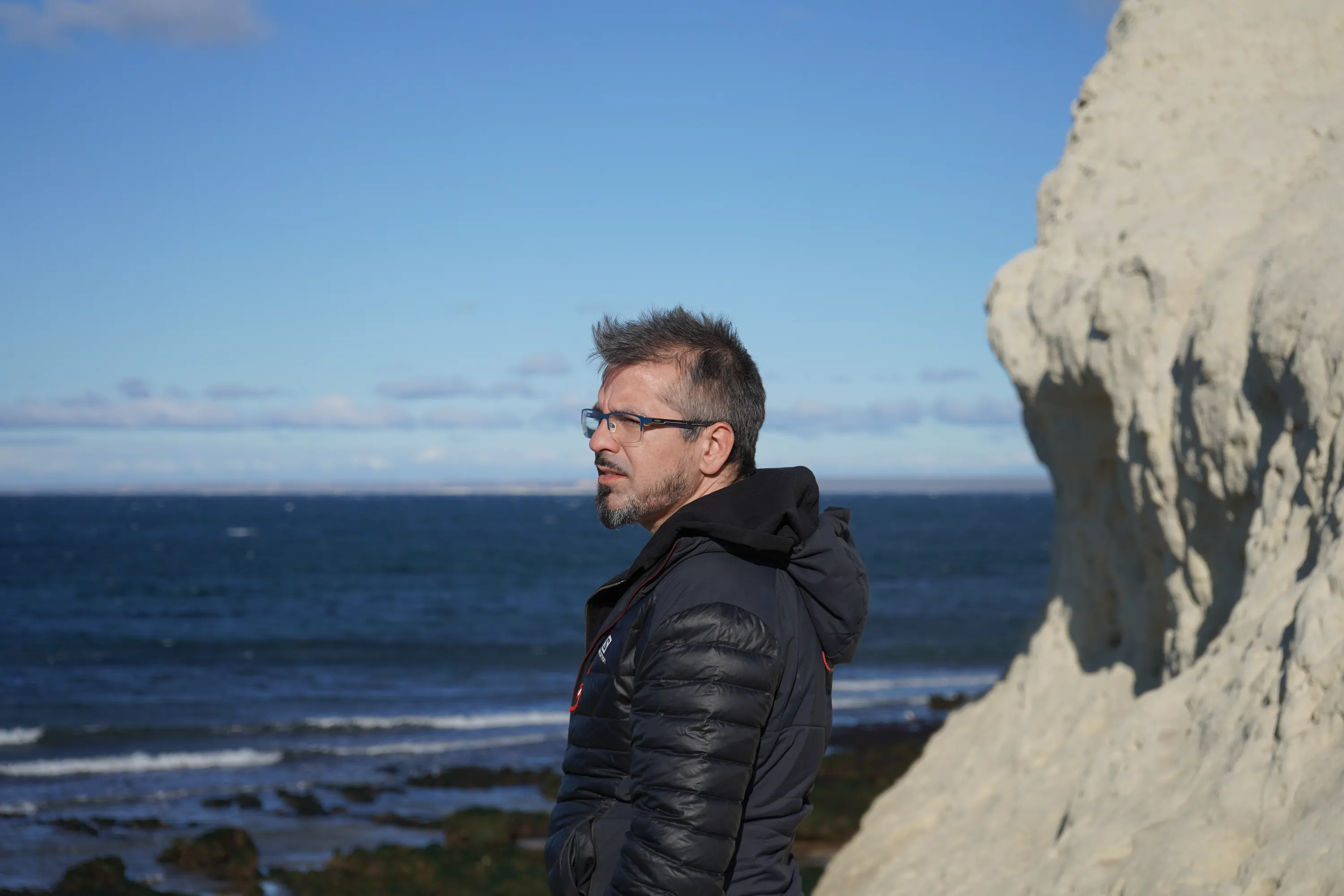Individual admiring ocean scenery in Puerto Madryn, Argentina